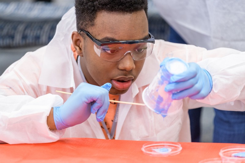 A student engages with an experiment.