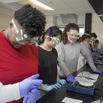 COE - MSEG - Hewlett - How I Teach - 03.13.23 students in goggles work in a materials science lab