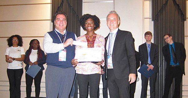 Amira Idris accepting award