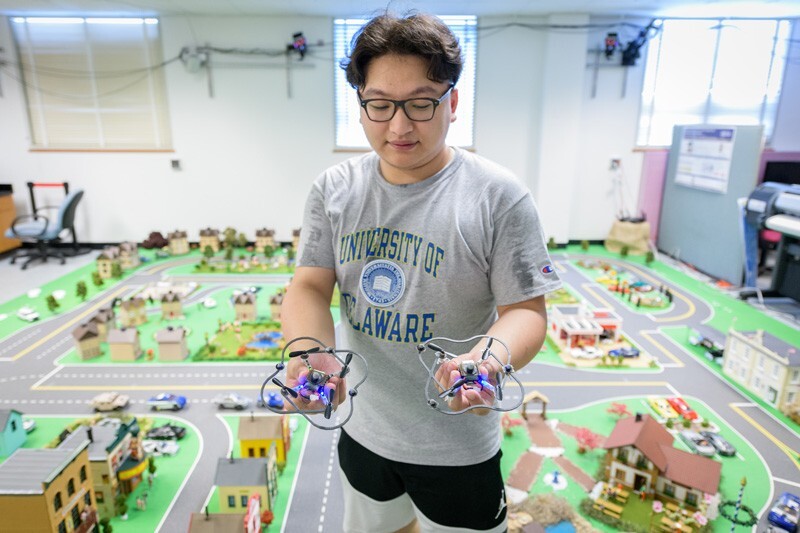 Yiming Wan stands in UD's mini smart city