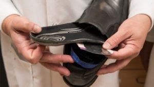 Dr. Thostenson holding a sensor