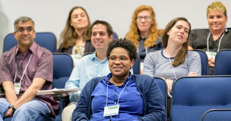 participants are seated at a session