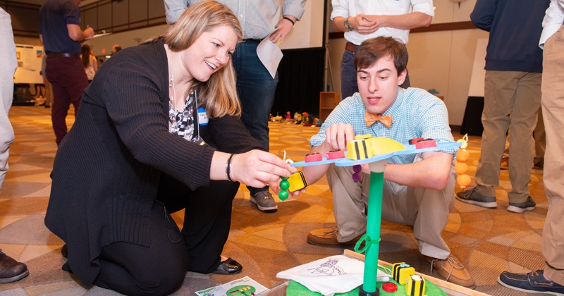 Carrie Aitkenhead, education outreach coordinator at Melissa and Doug, evaluates a toy with Christopher Hodges, a mechanical engineering student at UD.