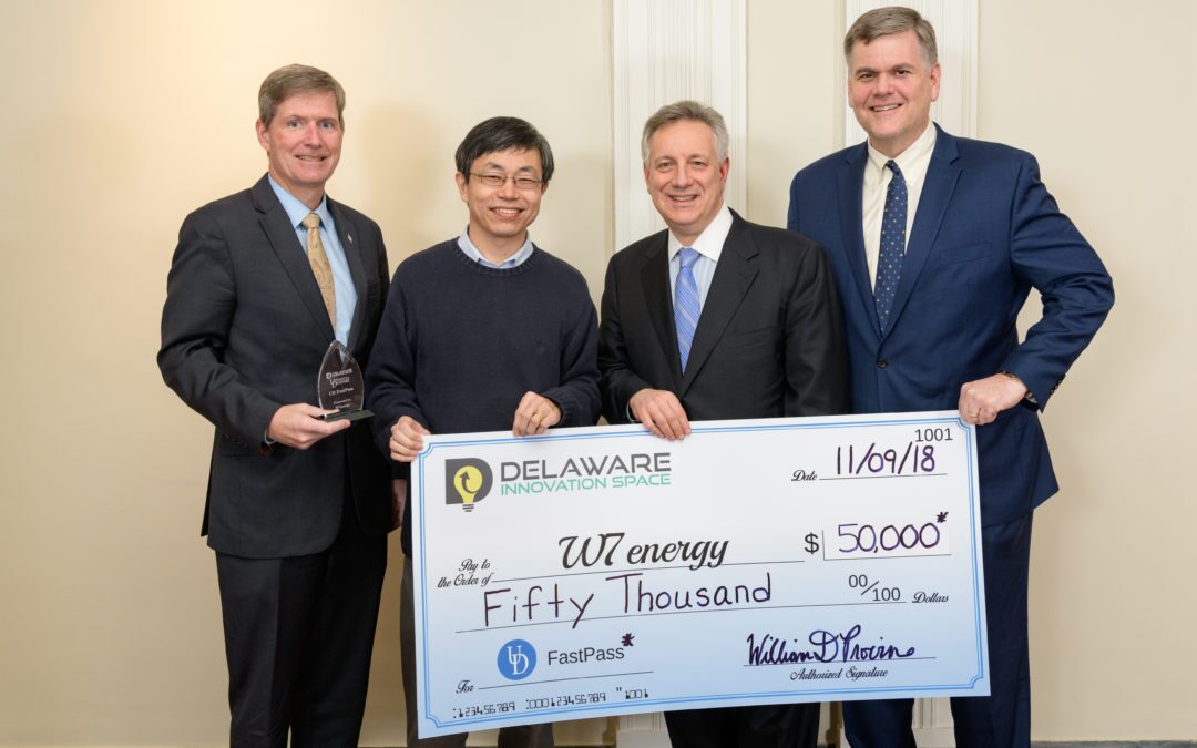 Yushan Yan receives a check for his startup W7 Energy