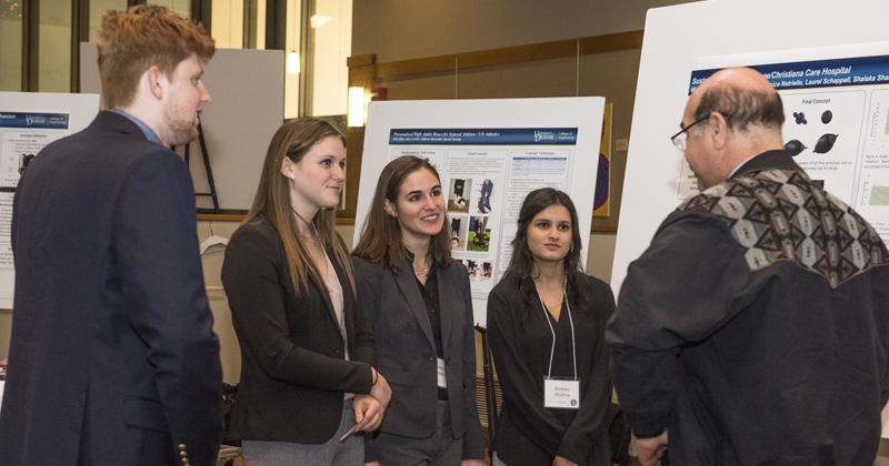 students speak with a mentor