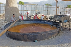 Workers in Pune, India, make jaggery in the traditional open-pan method.