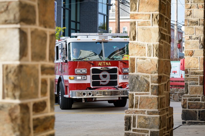 The firefighters return from an emergency call to Aetna Hose Hook and Ladder Company Station 9 in Newark. 