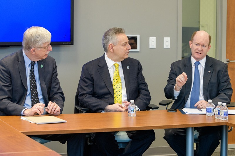 U.S. Sen. Chris Coons (right) makes a point during the discussion that Coons, NIH Director Francis Collins (left) and UD President Dennis Assanis had with students.