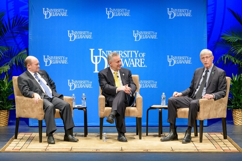 UD President Dennis Assanis (center) moderates a discussion between U.S. Sen. Chris Coons (left) and National Institutes of Health Director Francis Collins regarding research and healthcare in the United States and the rest of the world.