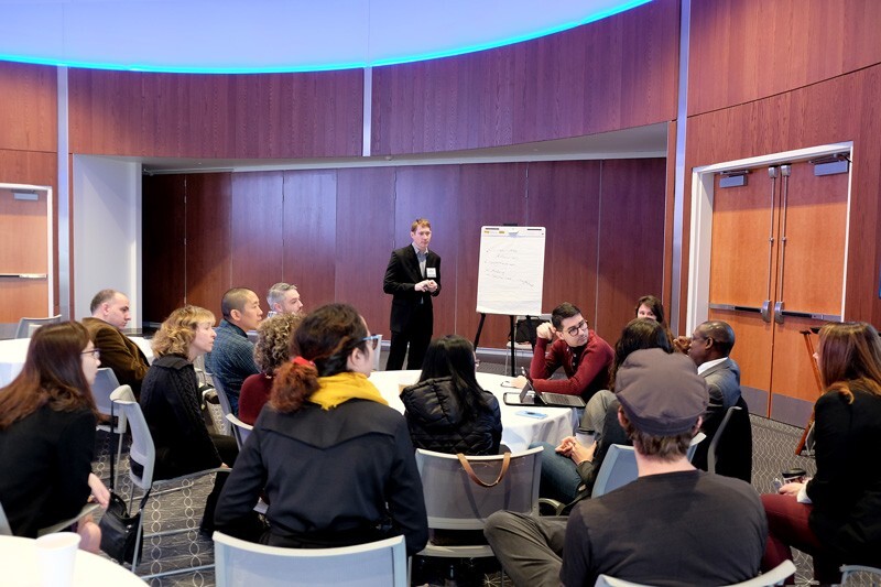 Researchers, clinicians and graduate students gathered in small groups to discuss ways to strengthen neuroscience work. Here, Keith Schneider, director of the Center for Biomedical and Brain Imaging, leads a group focused on cognitive neuroscience.