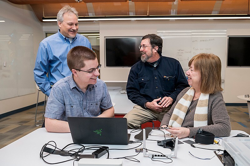 Device design is an iterative process that takes collaboration, communication and even some humor. Pictured from left to right: Prof. Richard Martin, UD junior Theodore Fleck, Prof. Scott Jones and Ingrid Predtzer-Aboff, senior nurse scientist at Virginia Commonwealth University.