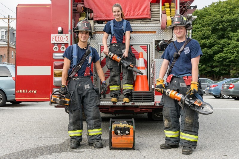 Matthew Heebner (left), Olivia Alexander (middle) and Connor Sproat are UD students who volunteer with the Aetna Hose Hook and Ladder Company Station 9 in Newark.