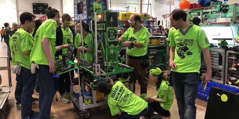 participants work on a robot
