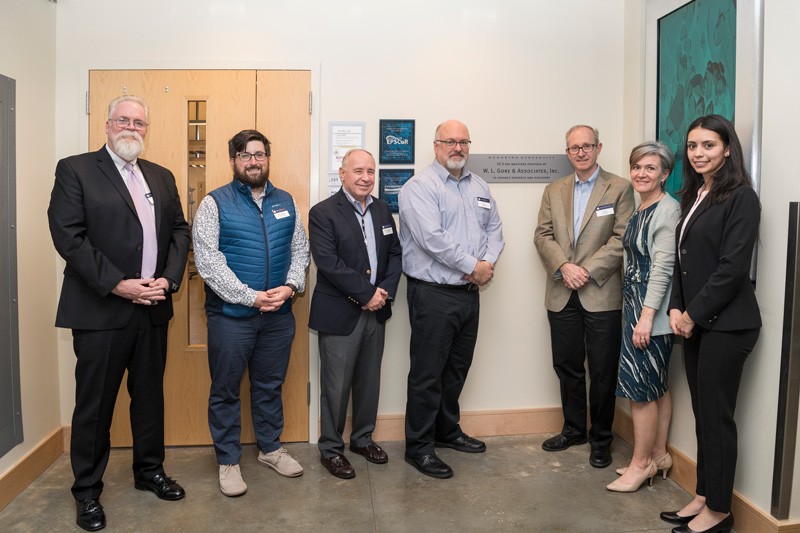 Representatives from Gore, Rigaku and UD pause before touring the Advanced Materials Characterization Laboratory. Pictured from the left: Tom McNulty (Rigaku), Gore representatives John Delluca (a UD alumnus), Michael Dougherty, Jeffrey Ledford, Greg Hannon, Amy Calhoun, and UD doctoral student Angela Cuadros.