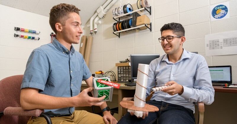 UD undergraduates Jeffrey Neumann (left) and Ahmad Tamimi are working on the power system and communications software for the ground stations for NASA’s CURIE mission.