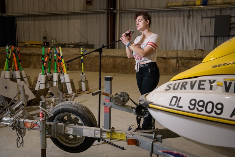 Sydney Cargill, member of the a capella group DelReMi, says she’s “transported to a different world” when she sings, which she does even while at work in the Coastal Engineering Lab, pictured here.