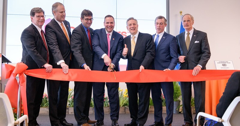 Leaders gather to celebrate the opening of the 312,000-square-foot Discovery Hub, which will be the home base for more than 300 innovators.