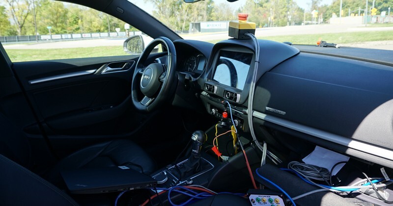 Here is a glimpse inside the connected and automated vehicle being studied by UD researchers. Various wires and devices are connected to the vehicle dashboard.