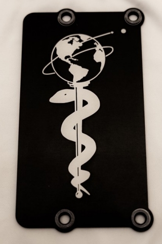 Members of NASA's Mars 2020 Perseverance rover mission installed a plate on the left side of the rover chassis, commemorating the impact of the COVID-19 pandemic and paying tribute to the perseverance of healthcare workers around the world. Made of aluminum, the 3-by-5-inch (8-by-13-centimeter) plaque was attached to the rover in May 2020 during final assembly at Kennedy Space Center in Florida.