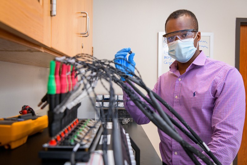 Koffi Pierre Yao, assistant professor of mechanical engineering and UD alumnus, has received a $1 million grant to engineer a next-generation lithium ion battery that could revolutionize the energy industry. In this photo, he conducts electrochemical testing.