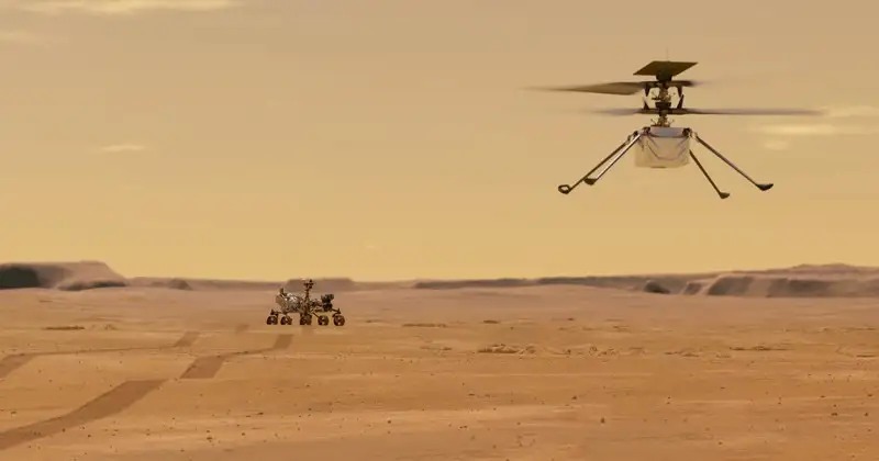 This NASA illustration depicts Mars Helicopter Ingenuity during a test flight on Mars. Ingenuity was taken to the Red Planet strapped to the belly of the Perseverance rover (seen in the background). Ingenuity, a technology experiment, will be the first aircraft to attempt controlled flight on another planet in 2021.