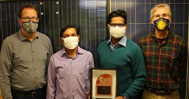 From left to right, William Shafarman, Ujjwal Das, Anishkumar Soman and Steven Hegedus with the John and Barbara Yellott Award.