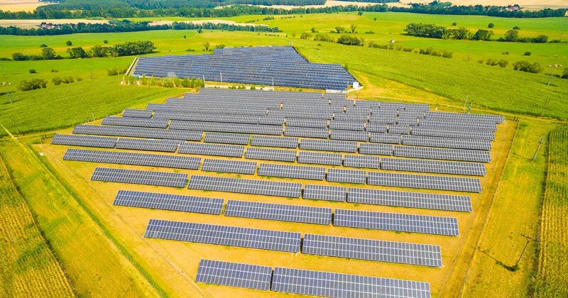 A yellow field with a solar array.