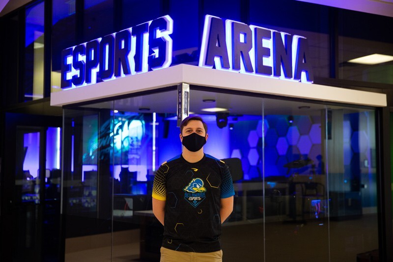 Will Kuper, a junior mechanical engineering major from Mount Laurel, New Jersey, stands in front of the ESports Arena
