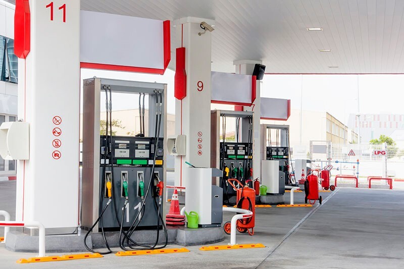 Three fuel pumps with red accents.