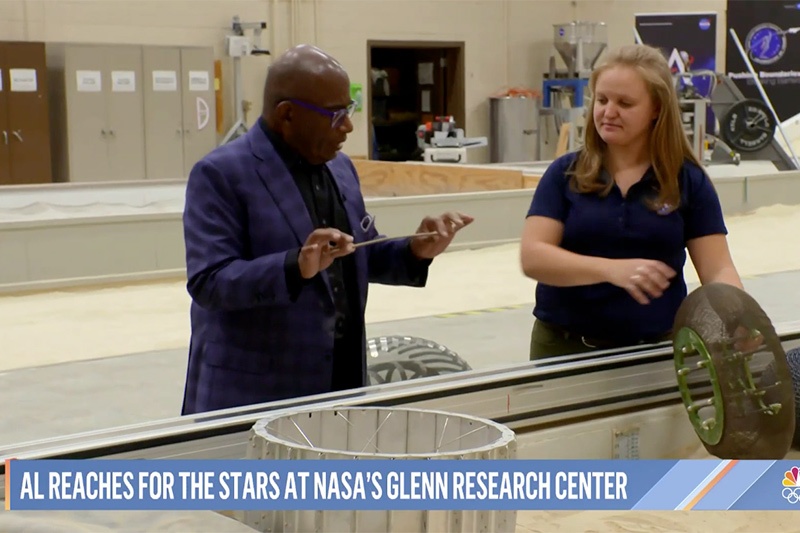 Al Roker and Erin Rezich examine experimental tires for Moon and Mars vehicles.