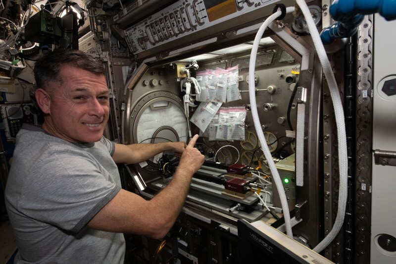 NASA astronaut Shane Kimbrough sets up the Microgravity Glovebox.