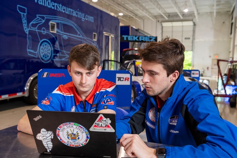 College of Engineering student Rory van der Steur (right) has been able to juggle his mechanical engineering studies and his passion for race car driving, something he has done since the age of four. Rory's crew chief, Chris Deely, is also a UD alum.