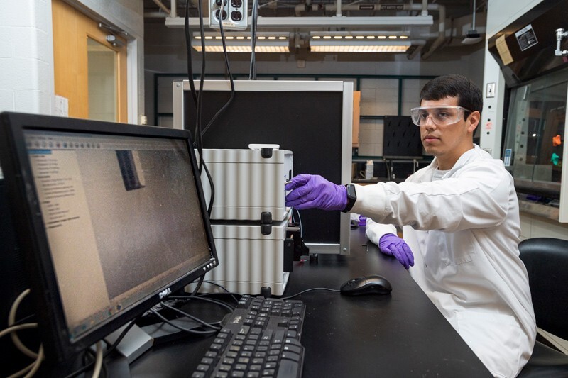 As part of his work with UD’s Center for Plastics Innovation, Eduardo Nombera-Bueno works with an electrospinner, a machine used to create incredibly strong synthetic fibers thinner than a human hair.