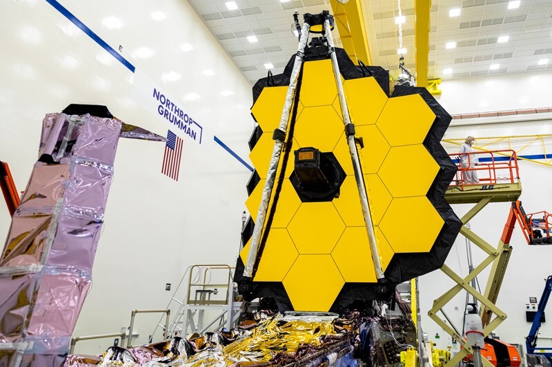The James Webb telescope with it's sunshields rolled up. The mirrors are partially folded.