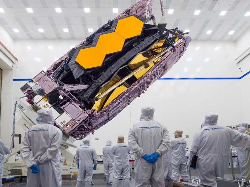 The James Webb Space Telescope is in the process of being packed. The mirrors are complete folded along with the rest of the structure to fit into the payload.