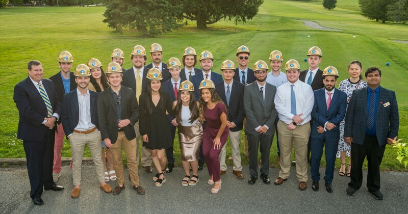 At left, Edgar Small at a May 2021 celebration for UD's first graduating class of the Construction Engineering and Management Program
