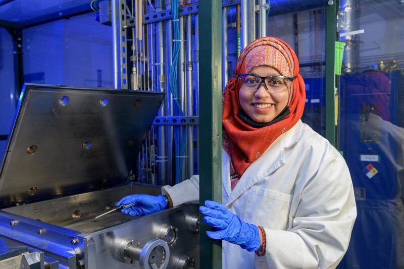 Tasnim Kamal Mouri working with a gas reactor.