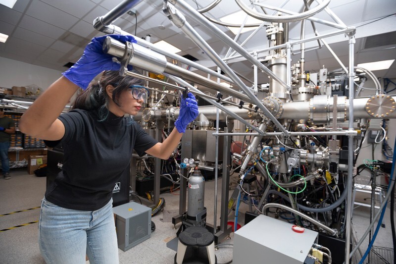 In the University of Delaware Materials Growth Facility, doctoral student Nazifa Tasnim Arony uses a method called molecular beam epitaxy to deposit atoms of various elements, layer by layer, to build a new material for potential use in quantum computers. She and her collaborators will then test the material's optical properties.