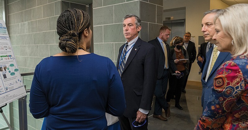 Prof. LaShanda Korley speaks to Gov. John Carney.