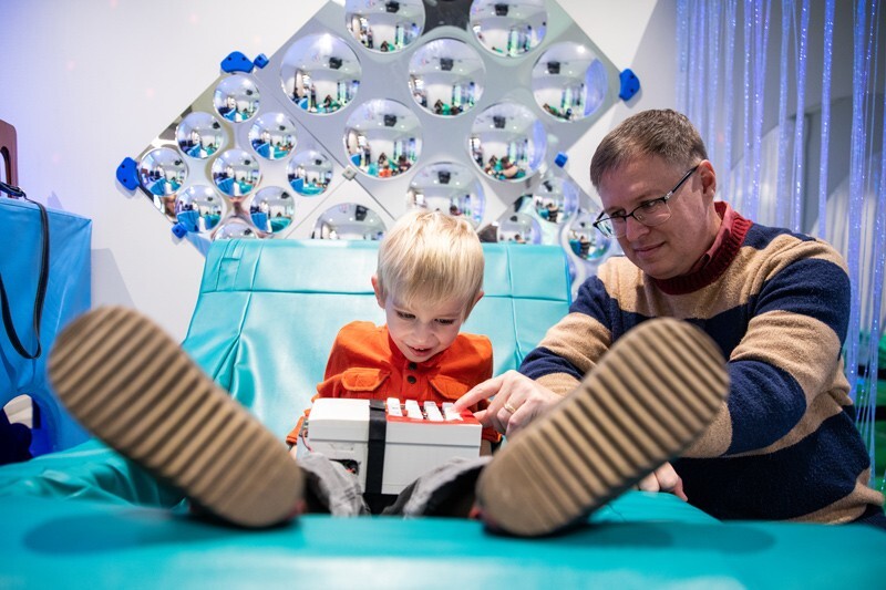 Daniel Stevens (right), professor of music theory works with a child using their composing device.