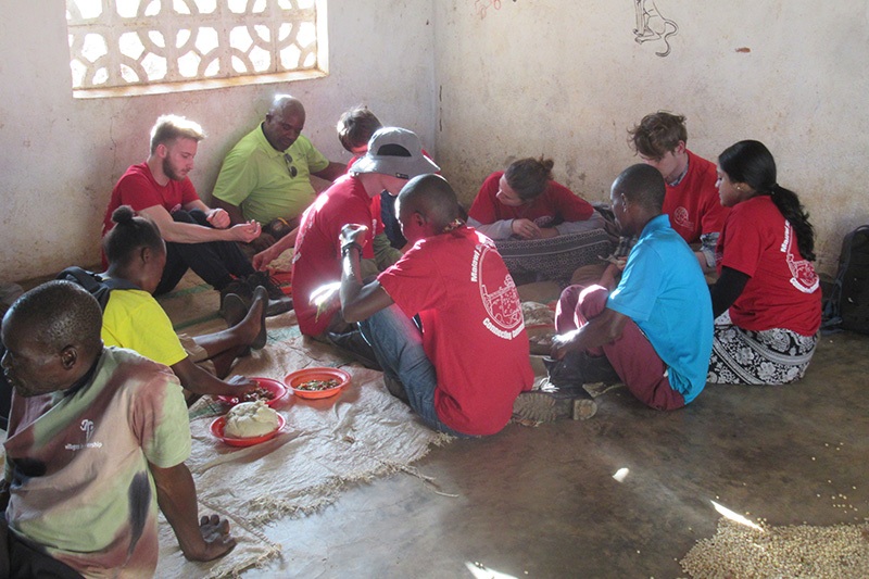 Eating with the community after a long day of field work. Courtesy of Kylie Short 