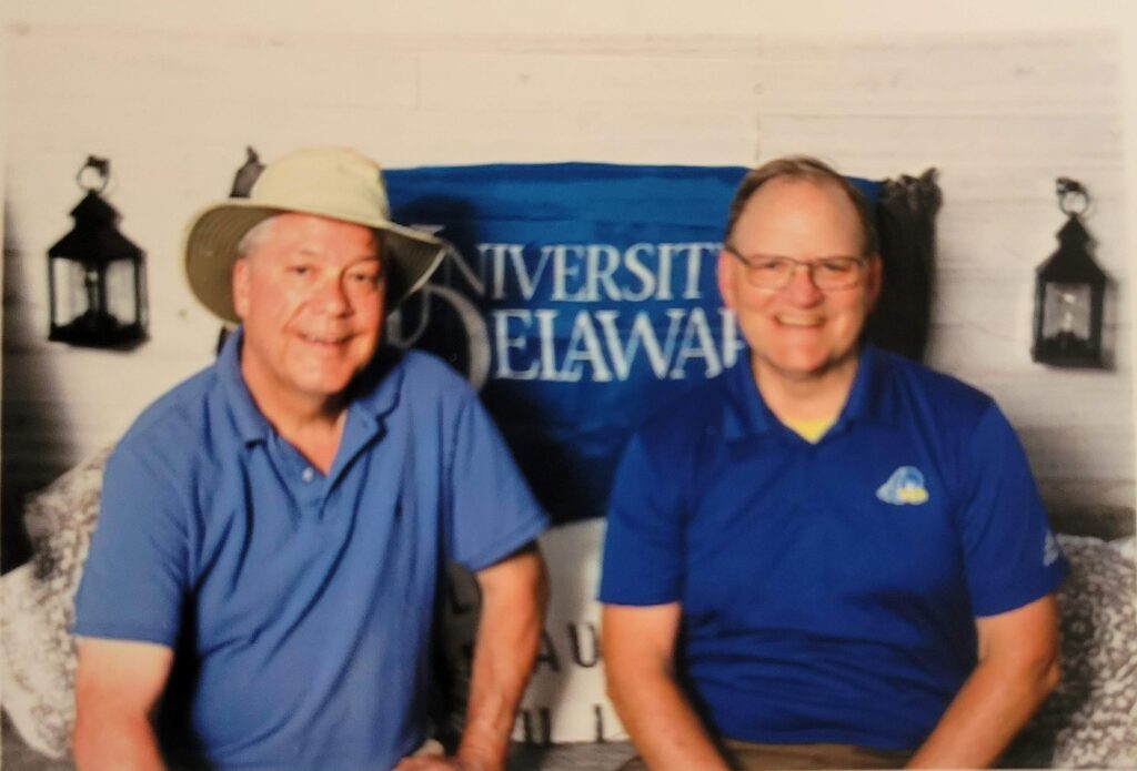 Dennis and Mr. Dixon are pictured after winning the cornhole competition at a 2023 staff picnic. Courtesy of Pat Dennis.