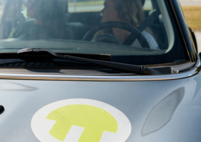 Students driving electric vehicle