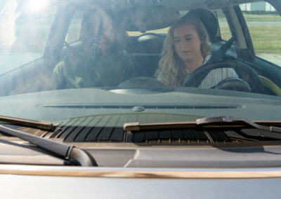 Students driving electric vehicle