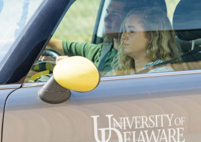 Students driving electric vehicle