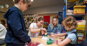 Students at UD's children campus are pictured testing toys.