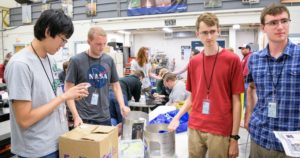 Examing Payload, four students at table