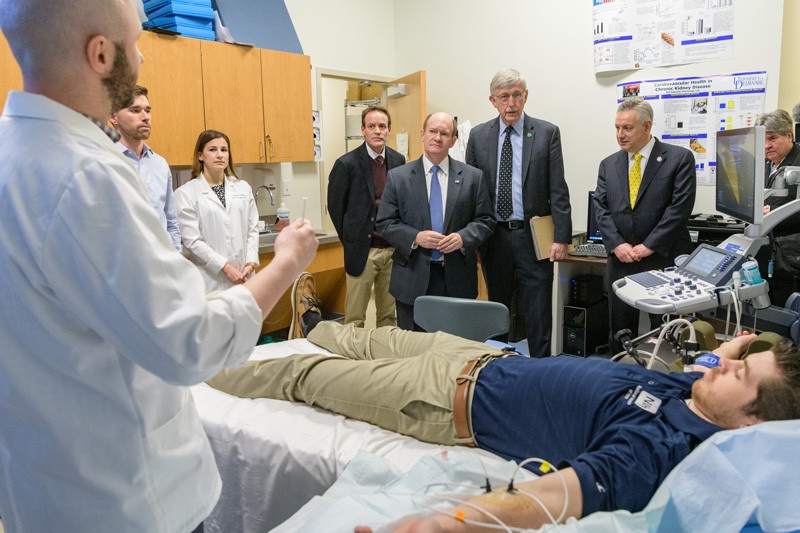 One of the labs NIH Director Francis Collins and others visited was the Vascular Physiology Lab directed by Prof. David Edwards, who studies vascular function. Jordan Patik (far left), a postdoctoral fellow, explains part of the research process.