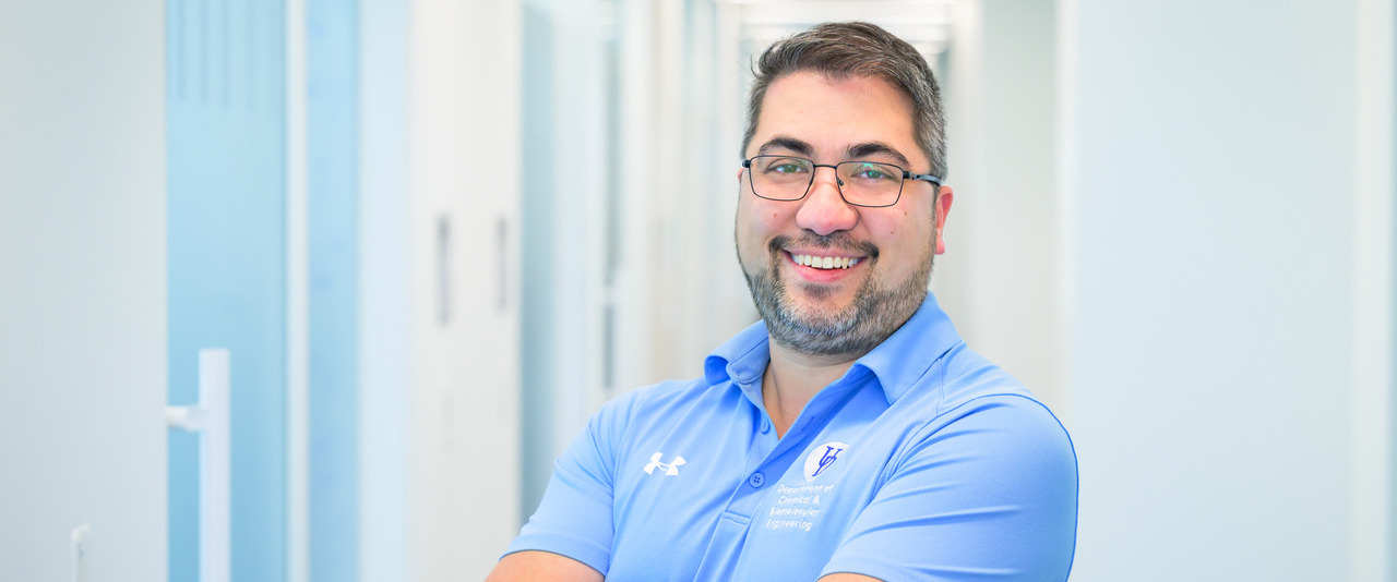 Environmental portraits of Mark Blenner, associate professor of Chemical and Biomolecular Engineering (CBE), photographed in his AP Bio laboratory.
