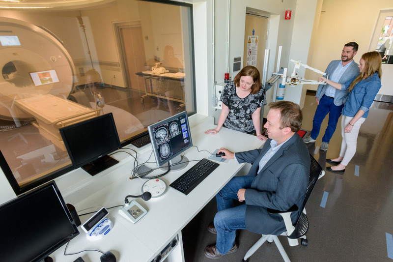 Curtis Johnson (seated at computer) with colleagues at CBBI. Credit: Evan Krape